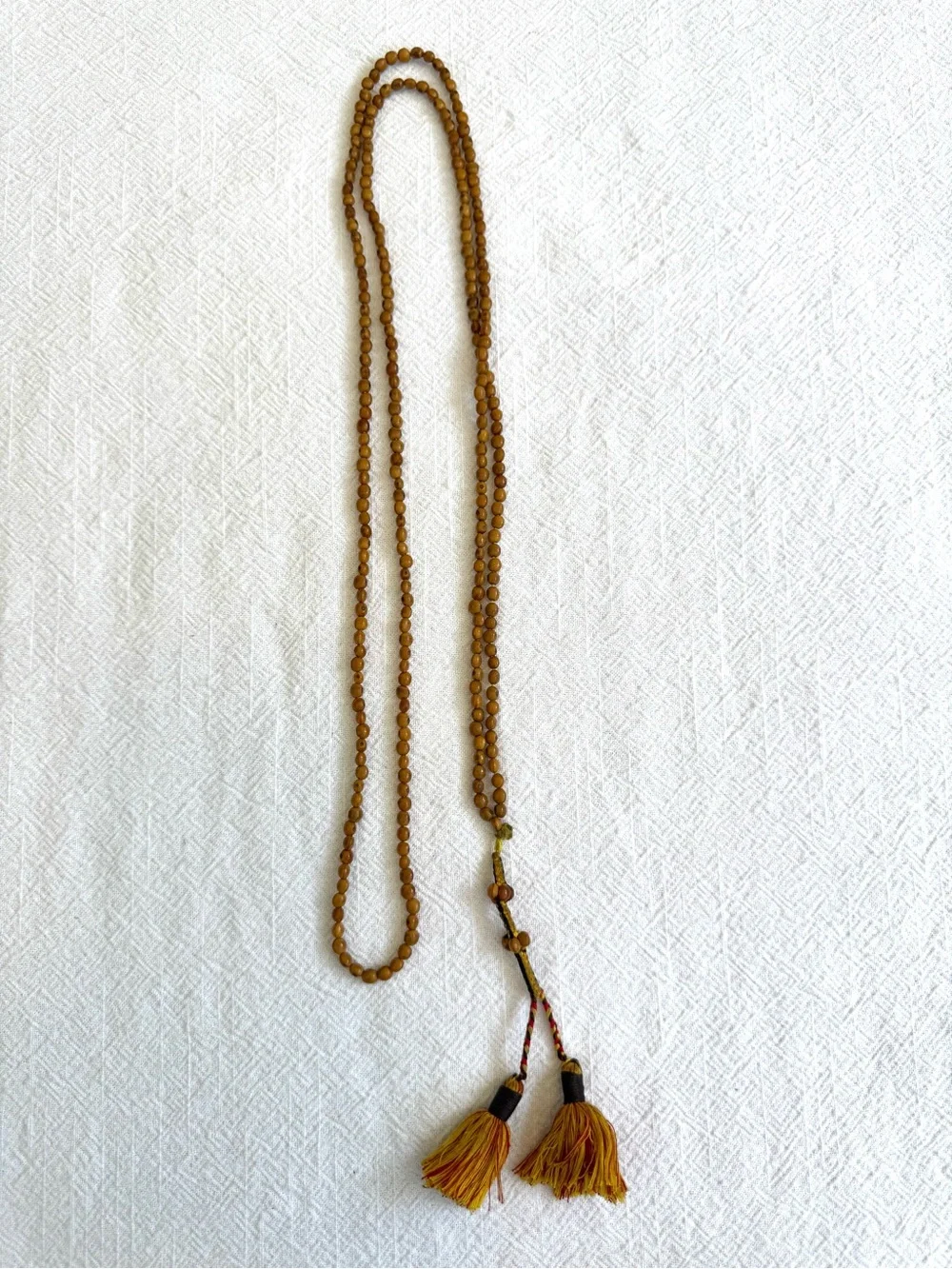 Meditation Beads: Knotted Chord with Small Beaded Sections and Tassels.